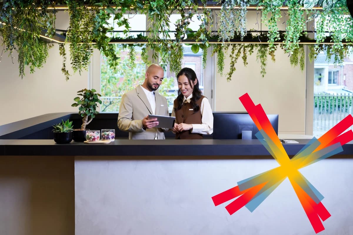 Two workers at hotel reception